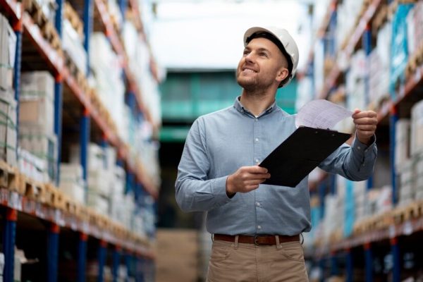 medium-shot-smiley-man-warehouse_23-2149214306